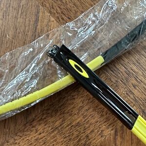 Oakley Black Frame with Yellow Accents Sunglasses Crosslink stems. 3 nose pieces
